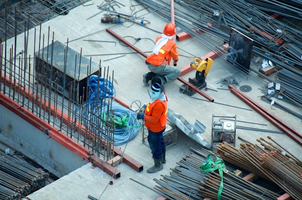 A technician in company uniform on a job site.